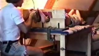 A merciless feet tickle torture inflicted on a red head young lady